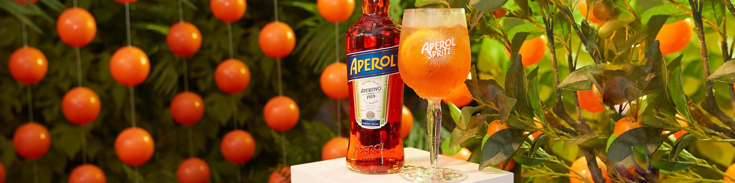 Aperol is the perfect aperitif. Bright orange in color, its unique bittersweet taste is derived from a secret recipe that has remained unchanged since its creation. Aperol was created in 1919 in Padova, Italy, by the Barbieri Brothers who launched the revolutionary idea of an aperitif with an alcohol content of only 11 percent. Their stylish and versatile creation inspired a cocktail which has become the signature drink of Italy: the Aperol Spritz. Buy Aperol online now from nearby liquor stores via Minibar Delivery. 